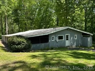 a backyard of a house with lots of green space