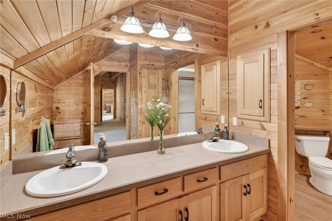 16727 Pitts Road Wellington, OH 44090 - Photo 24 of 50 Upstairs primary bathroom with double vanity