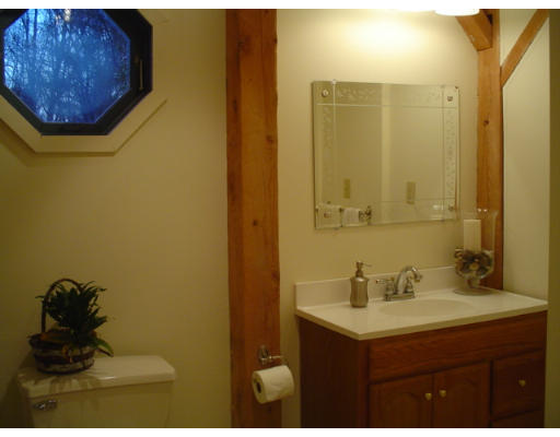 123 Randall Road Berlin, MA 01503 - Photo 21 of 26 a bathroom with a sink and a mirror