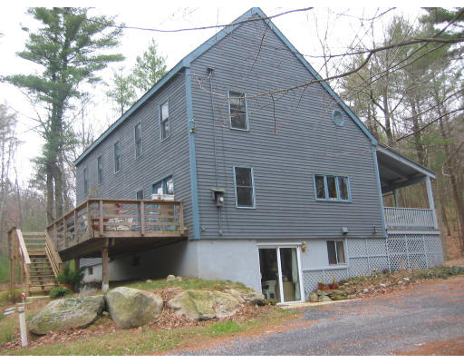 123 Randall Road Berlin, MA 01503 - Photo 24 of 26 a front view of a house with a yard