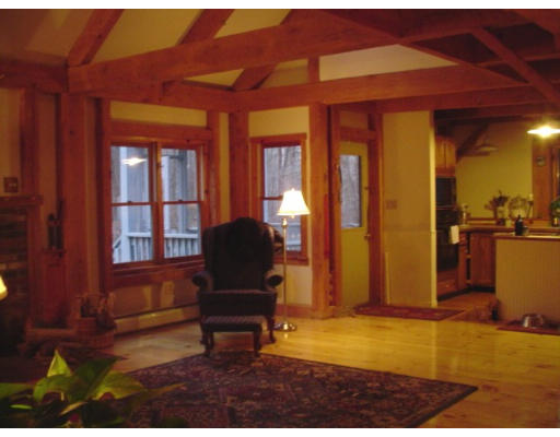 123 Randall Road Berlin, MA 01503 - Photo 5 of 26 a living room with furniture a piano and wooden floor