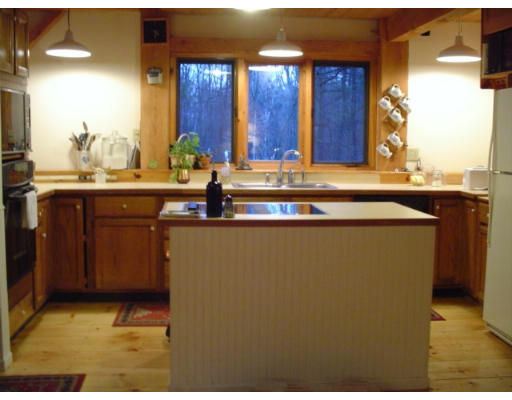 123 Randall Road Berlin, MA 01503 - Photo 6 of 26 a bathroom with a sink and a mirror