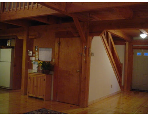 123 Randall Road Berlin, MA 01503 - Photo 7 of 26 a view of a hallway with wooden floor