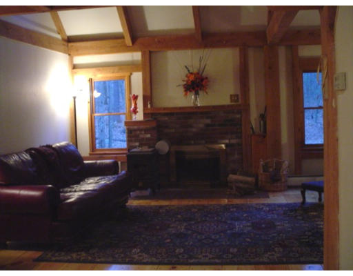 123 Randall Road Berlin, MA 01503 - Photo 8 of 26 a living room with furniture and a fireplace