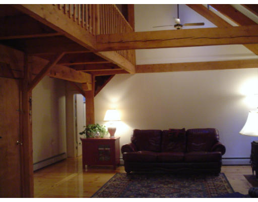 123 Randall Road Berlin, MA 01503 - Photo 10 of 26 a living room with furniture and a potted plant