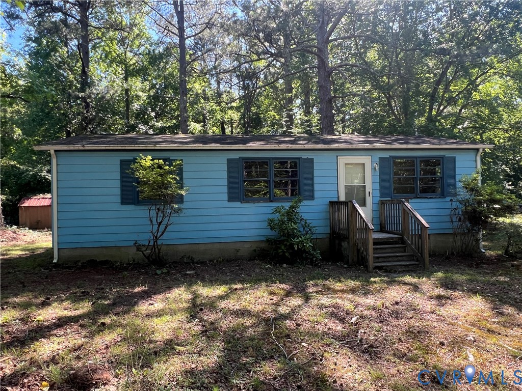 8501 Old Elam Cemetery Road Charles City, VA 23030 - Photo 1 of 14 Single-story residence featuring blue siding, a da