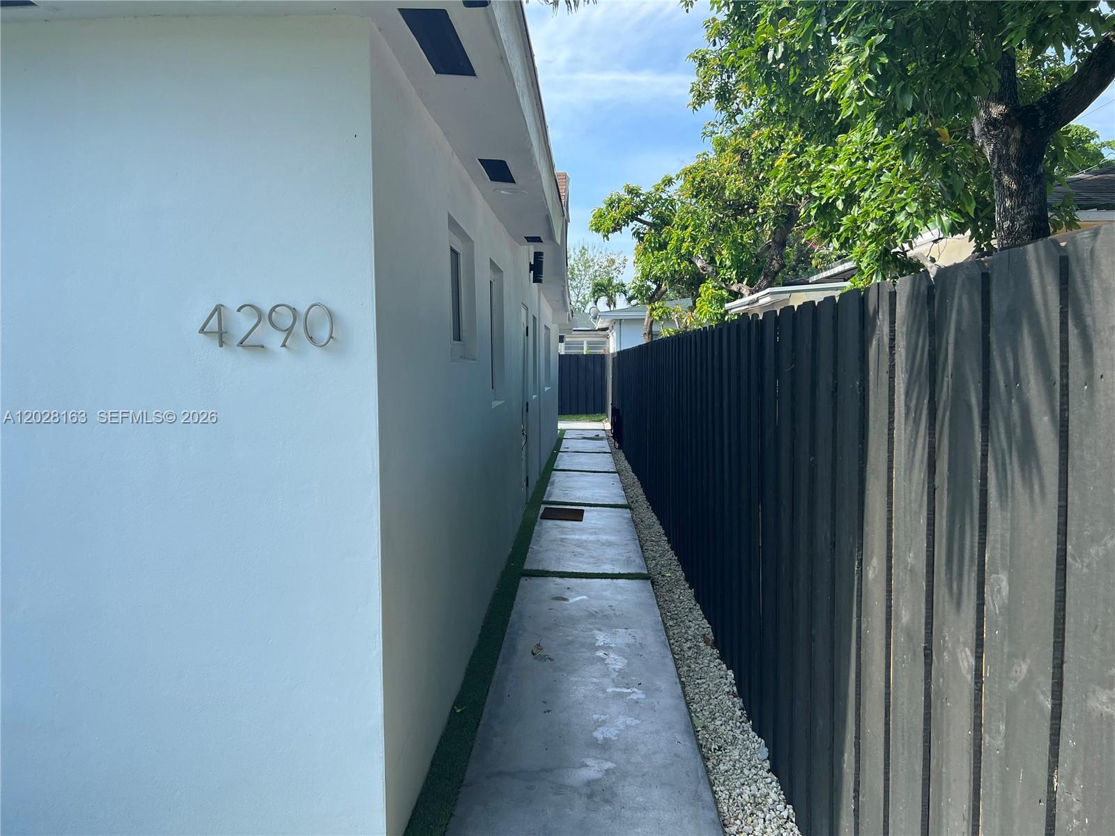 4290 Southwest 9th Street, Unit B Miami, FL 33134 - Photo 3 of 18 a view of a pathway of a building