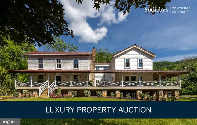a front view of a building with blue umbrellas