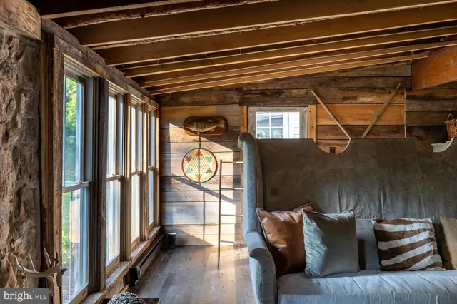 a view of a living room with furniture and a window