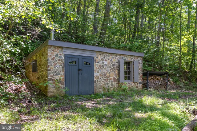 front view of a house with a tree