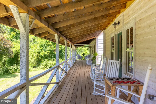 a view of balcony with wooden floor