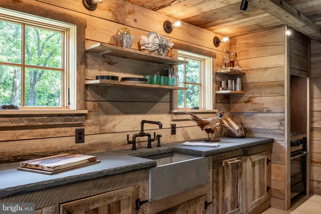 a kitchen with a sink and a stove