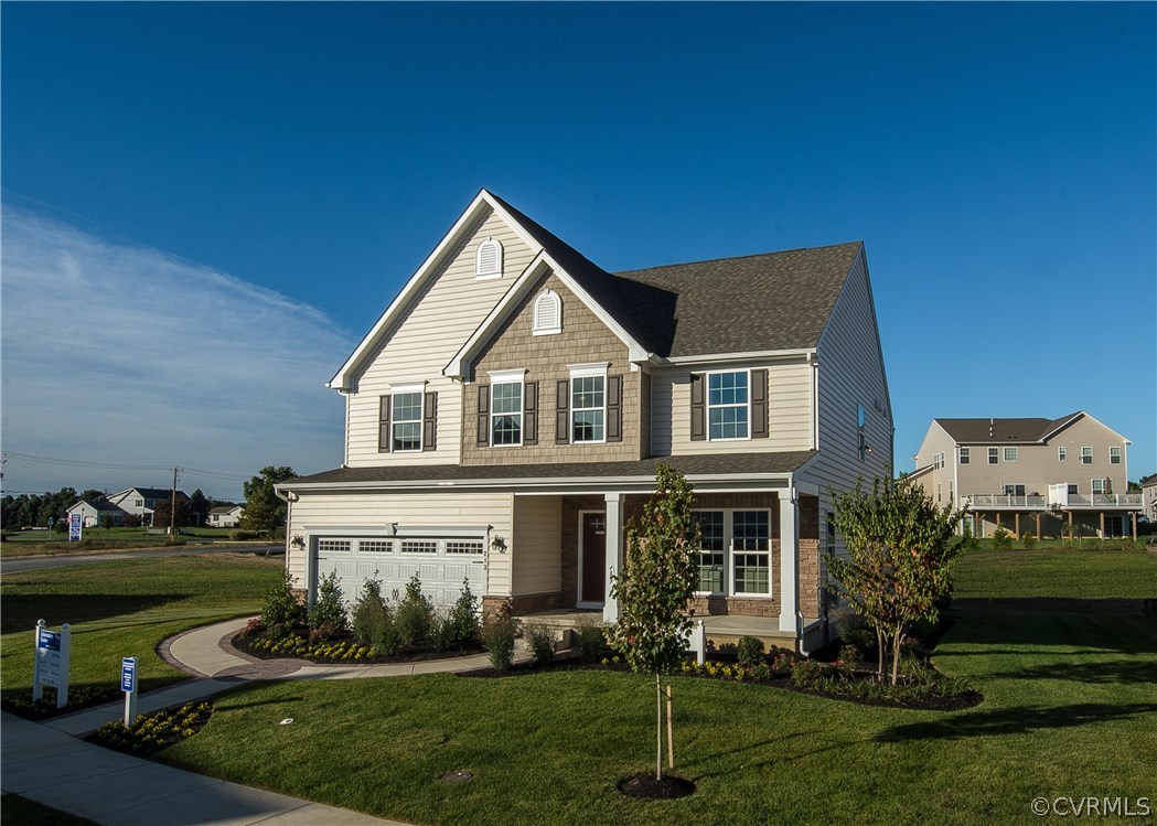 8725 Bailey Hill Road Midlothian, VA 23112 - Photo 1 of 1 a front view of a house with a garden and plants