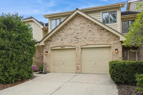 front view of a house with a small yard