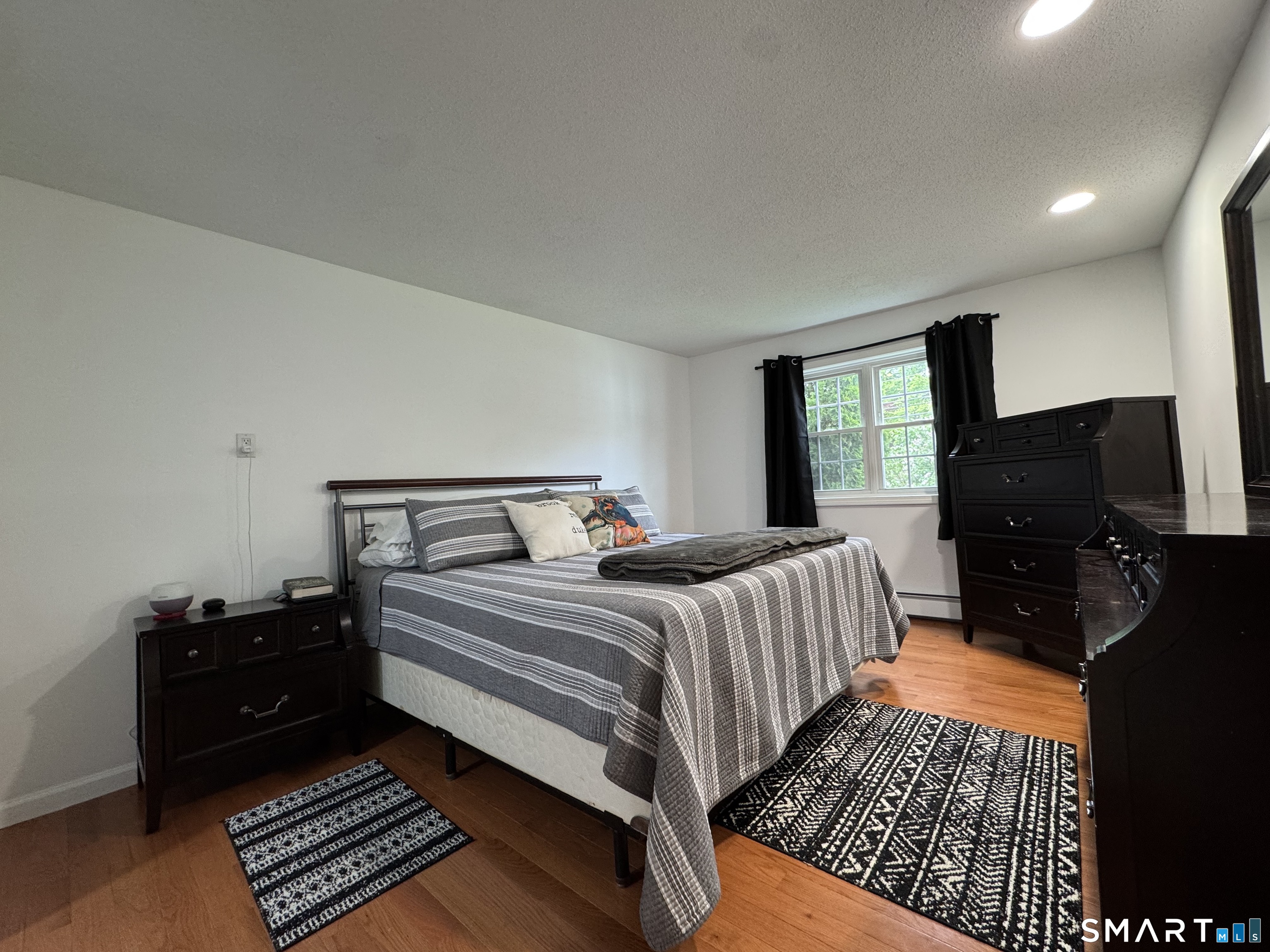 1514 Woodtick Road Wolcott, CT 06716 - Photo 9 of 23 a bedroom with double bed and a window