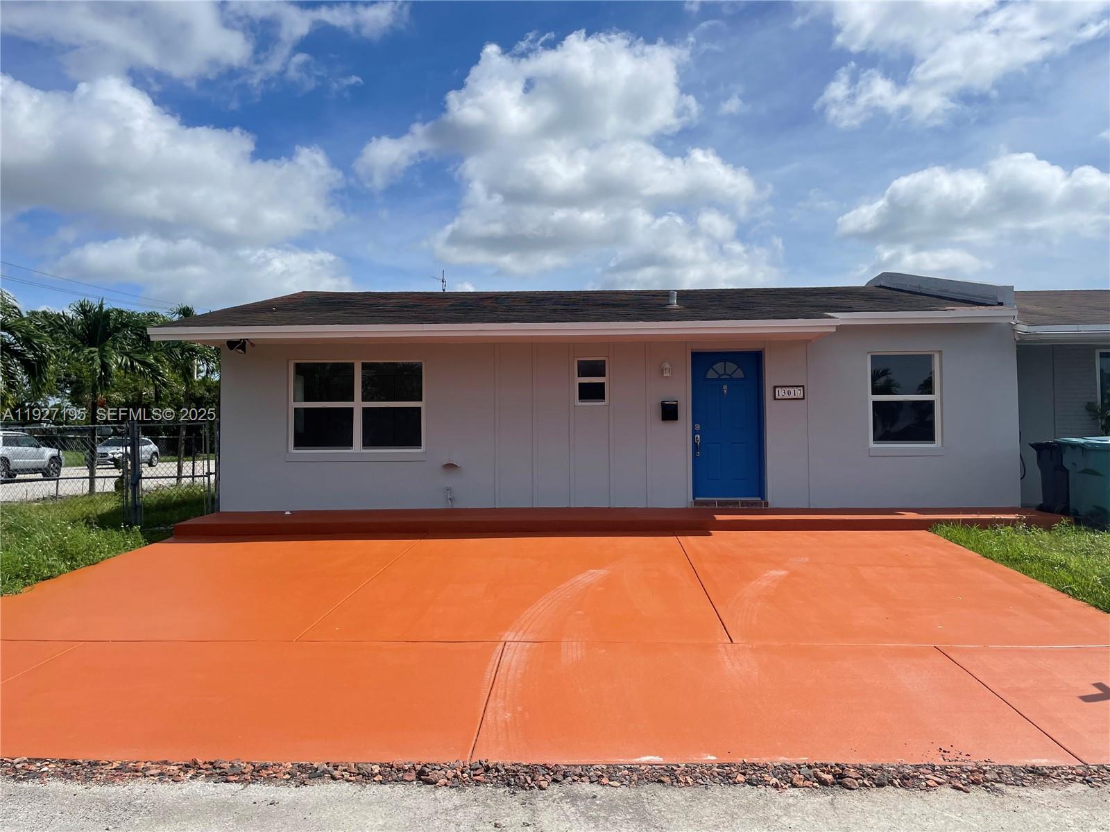 13017 Southwest 18th Terrace, Unit 13017 Miami, FL 33175 - Photo 1 of 21 a backyard of a house with yard and outdoor seating