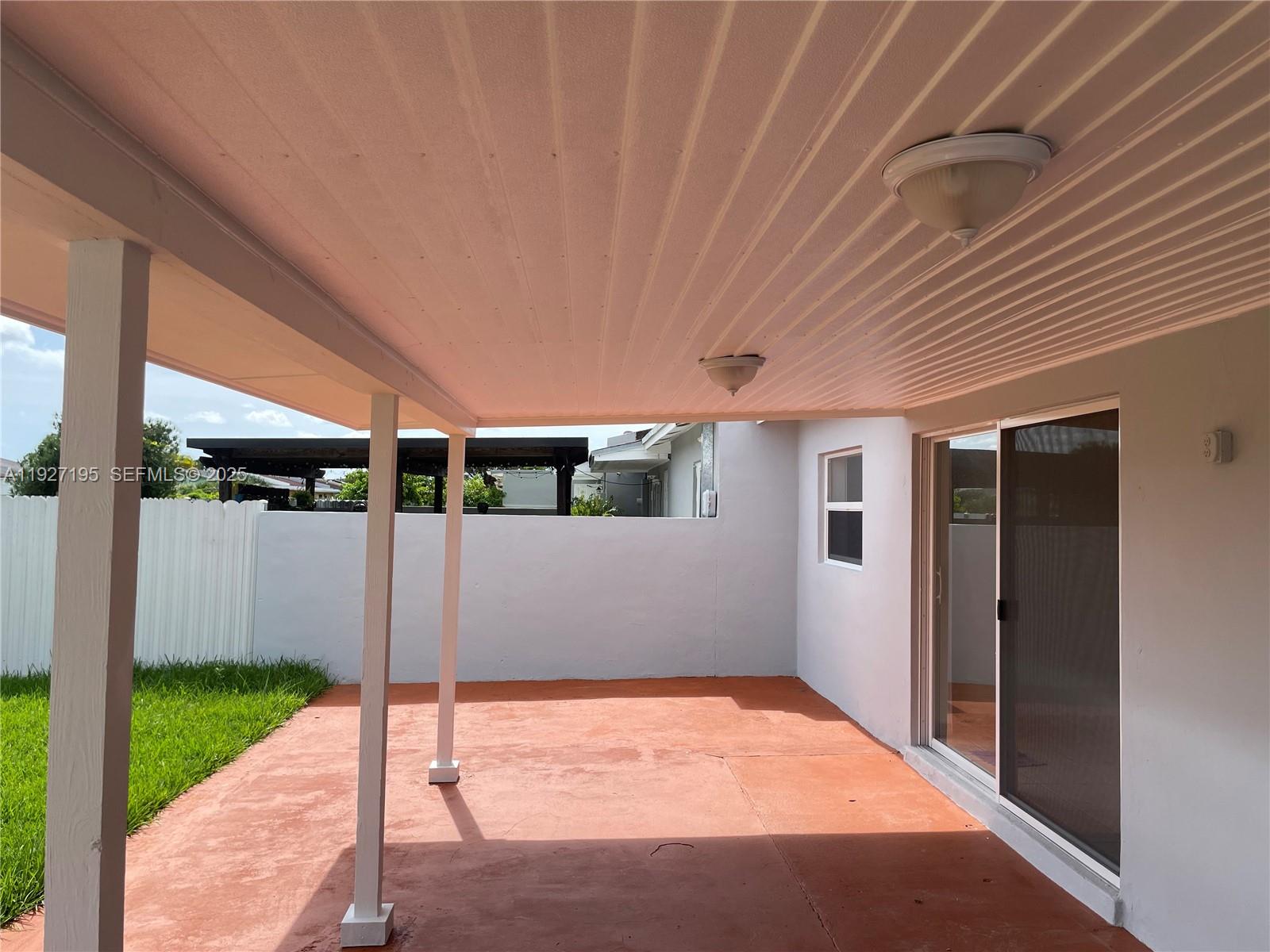 13017 Southwest 18th Terrace, Unit 13017 Miami, FL 33175 - Photo 15 of 21 a porch with seating space