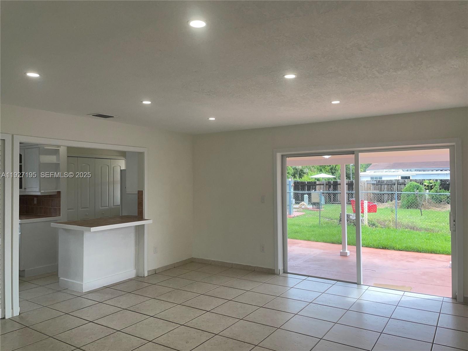 13017 Southwest 18th Terrace, Unit 13017 Miami, FL 33175 - Photo 17 of 21 a view of a porch and a garage