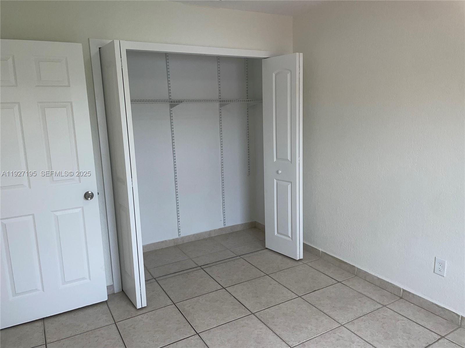 13017 Southwest 18th Terrace, Unit 13017 Miami, FL 33175 - Photo 20 of 21 an empty room with closet area