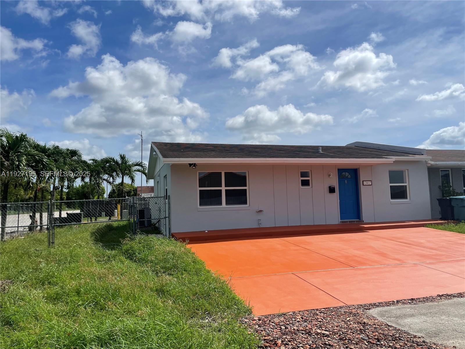 13017 Southwest 18th Terrace, Unit 13017 Miami, FL 33175 - Photo 4 of 21 a front view of house with yard