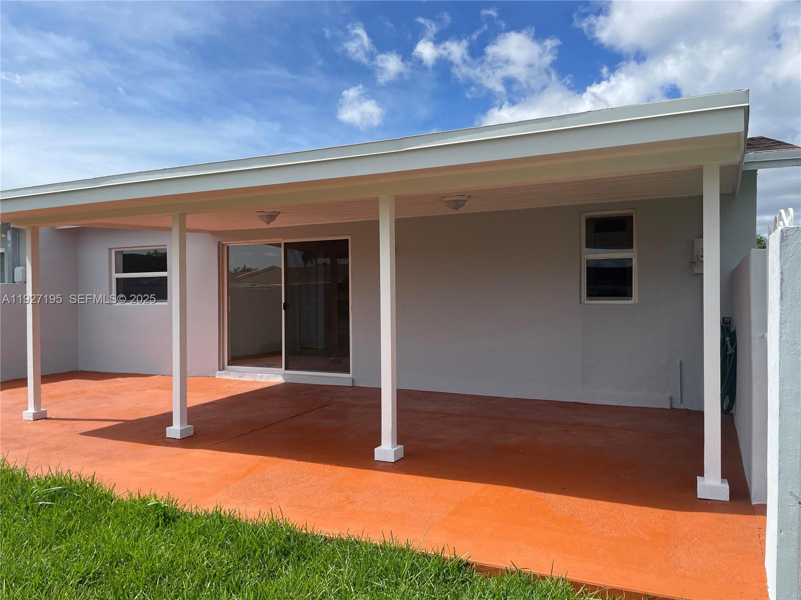 13017 Southwest 18th Terrace, Unit 13017 Miami, FL 33175 - Photo 5 of 21 a backyard of a house with seating space