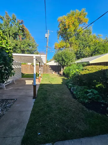 a view of a back yard of the house