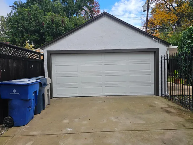 a view of a house with wooden fence