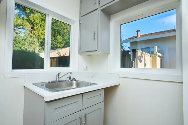 a kitchen with a sink and a window