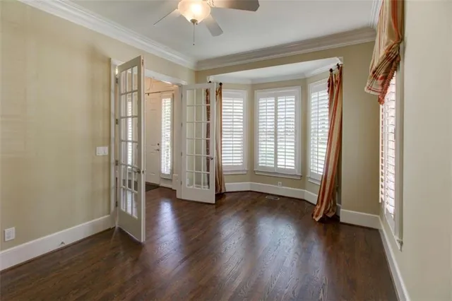 a kitchen with granite countertop a stove and a wooden floors