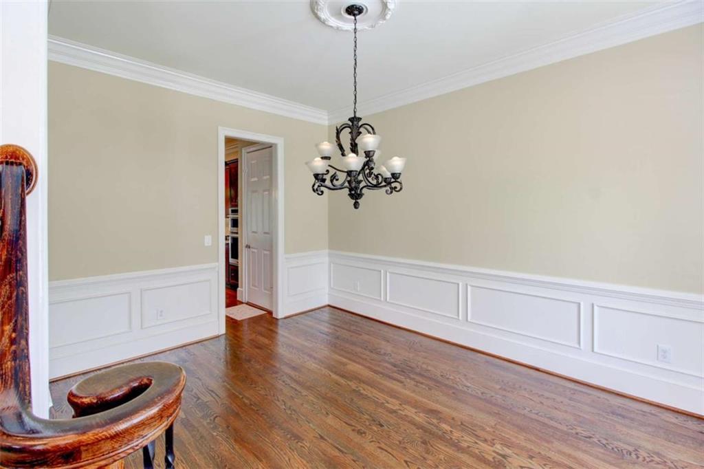 7520 Ledgewood Way Suwanee, GA 30024 - Photo 26 of 95 a view of a room with wooden floor and cabinets