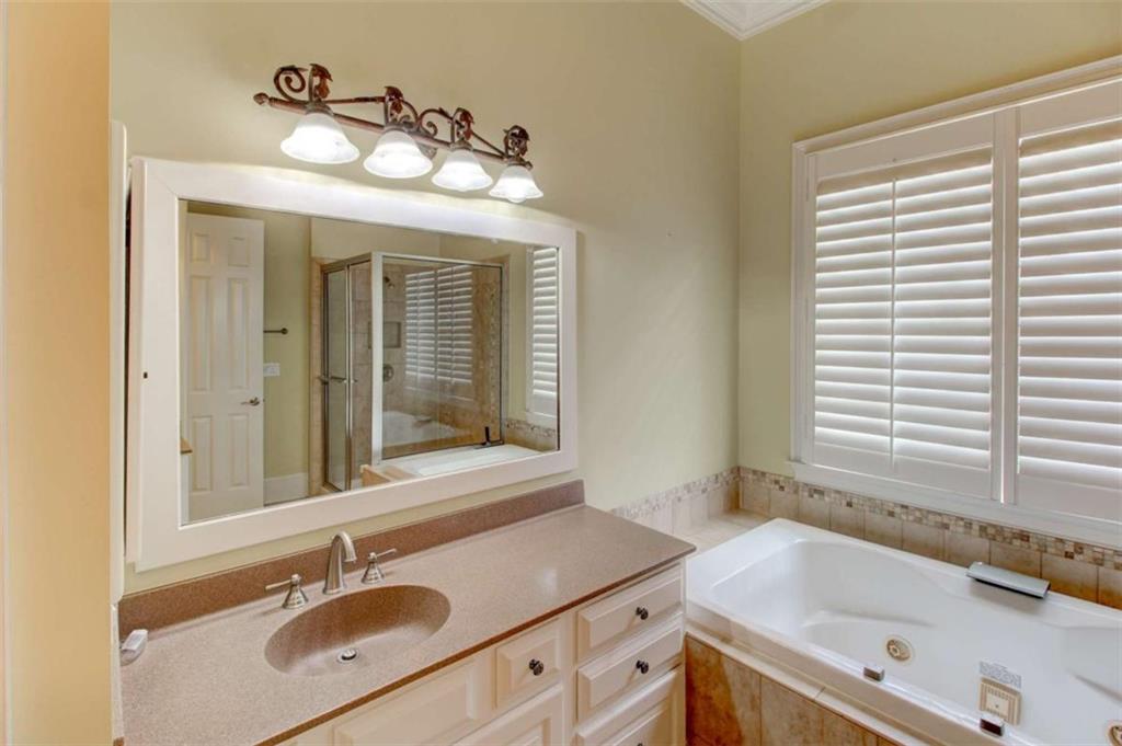 7520 Ledgewood Way Suwanee, GA 30024 - Photo 36 of 95 a bathroom with a sink and a bathtub