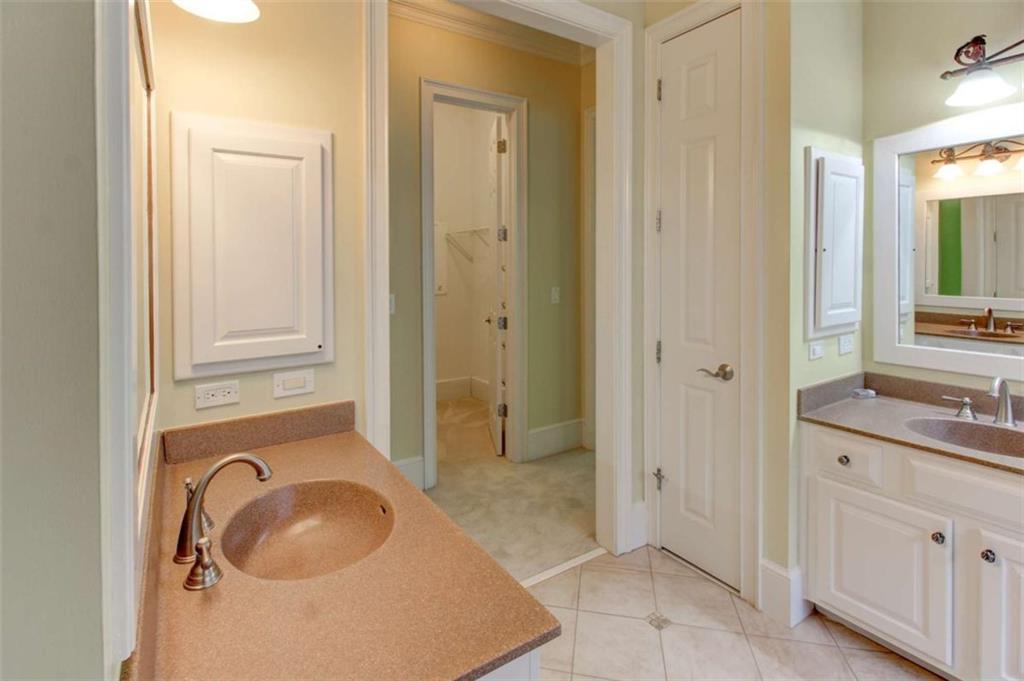 7520 Ledgewood Way Suwanee, GA 30024 - Photo 39 of 95 a bathroom with a granite countertop sink and a mirror
