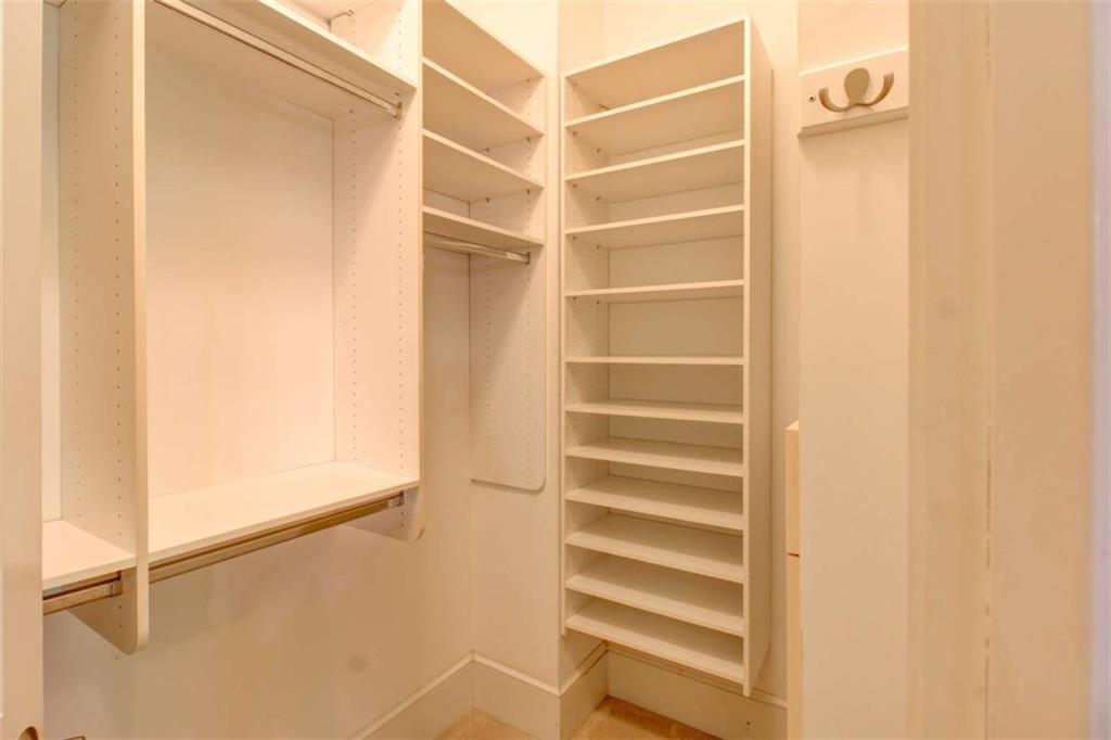 7520 Ledgewood Way Suwanee, GA 30024 - Photo 40 of 95 a view of closet area with empty racks