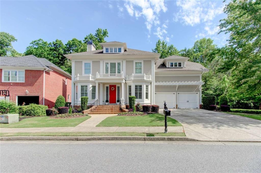 7520 Ledgewood Way Suwanee, GA 30024 - Photo 4 of 95 a front view of a house with a yard
