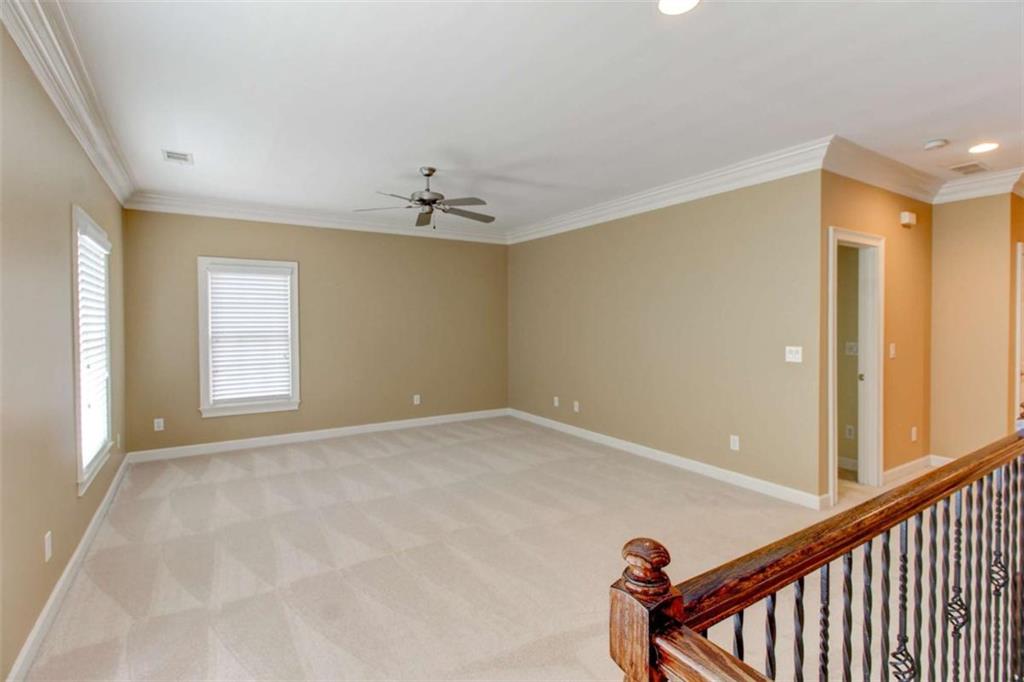 7520 Ledgewood Way Suwanee, GA 30024 - Photo 45 of 95 a view of an empty room with windows