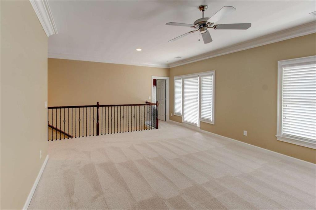7520 Ledgewood Way Suwanee, GA 30024 - Photo 47 of 95 a view of a livingroom with a ceiling fan and window