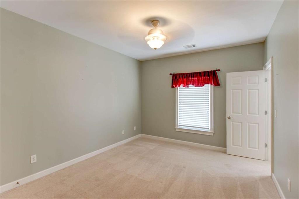 7520 Ledgewood Way Suwanee, GA 30024 - Photo 48 of 95 a view of an empty room with a window