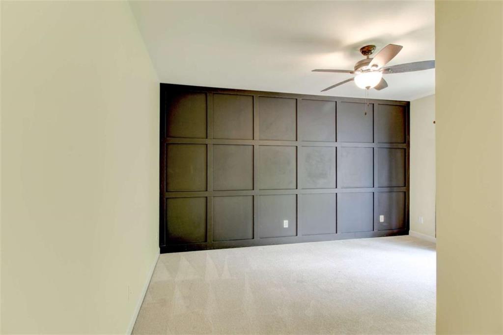 7520 Ledgewood Way Suwanee, GA 30024 - Photo 52 of 95 a view of an empty room with a ceiling fan