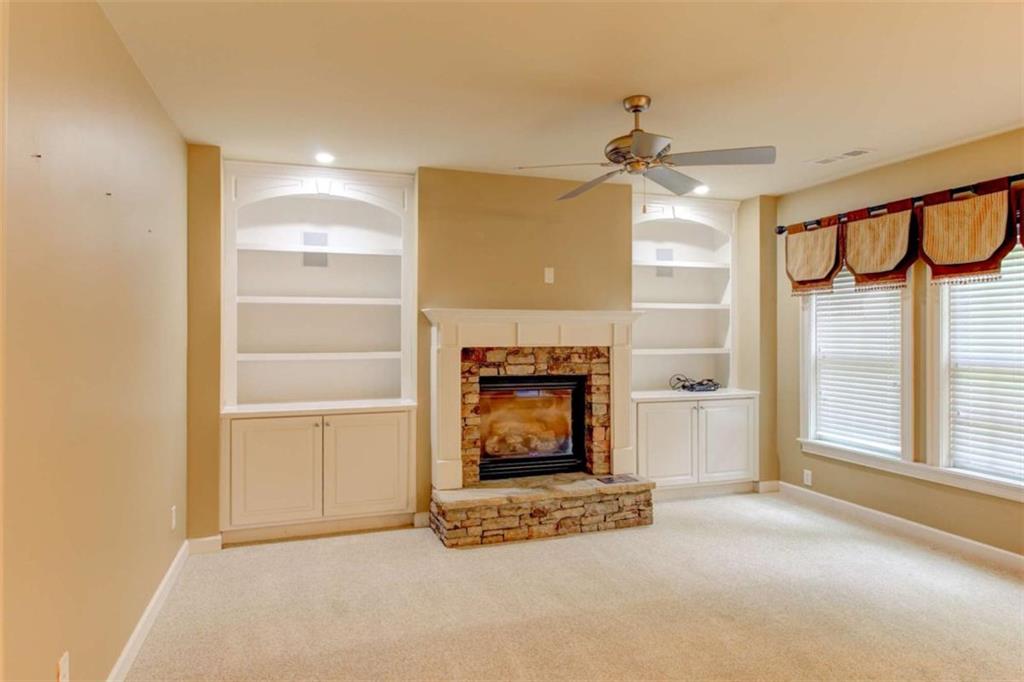 7520 Ledgewood Way Suwanee, GA 30024 - Photo 65 of 95 a view of an empty room with a fireplace and a window