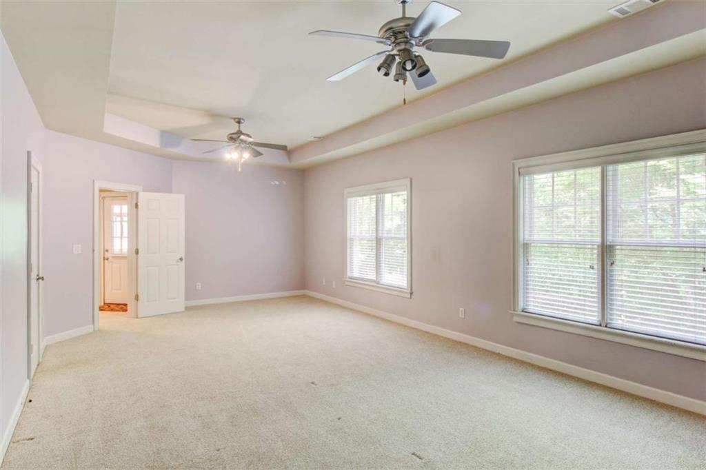 7520 Ledgewood Way Suwanee, GA 30024 - Photo 69 of 95 a view of a livingroom with a ceiling fan and window