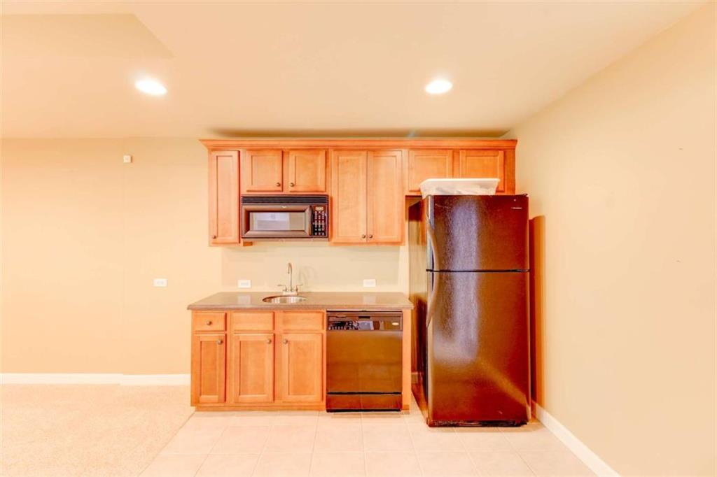 7520 Ledgewood Way Suwanee, GA 30024 - Photo 76 of 95 a kitchen with stainless steel appliances a refrigerator and a sink