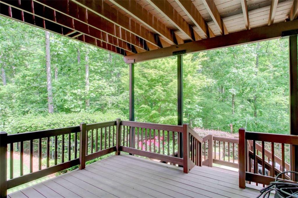 7520 Ledgewood Way Suwanee, GA 30024 - Photo 77 of 95 a view of a wooden deck next to a yard