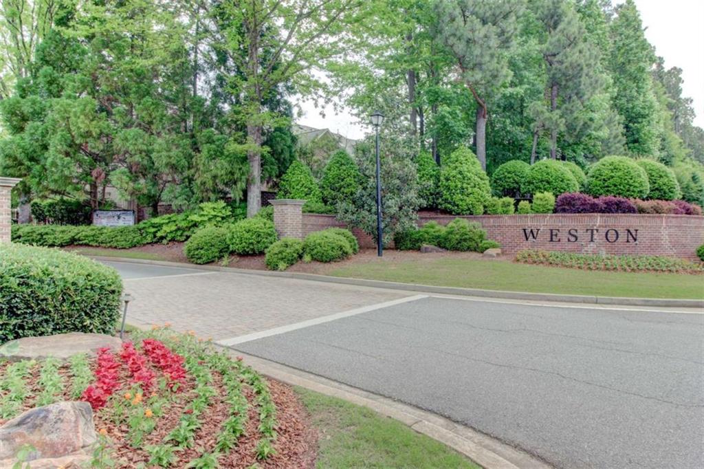 7520 Ledgewood Way Suwanee, GA 30024 - Photo 88 of 95 a sign that is sitting in the middle of a park