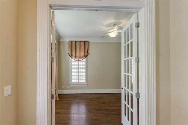 a kitchen with stainless steel appliances granite countertop a sink dishwasher stove and wooden cabinets