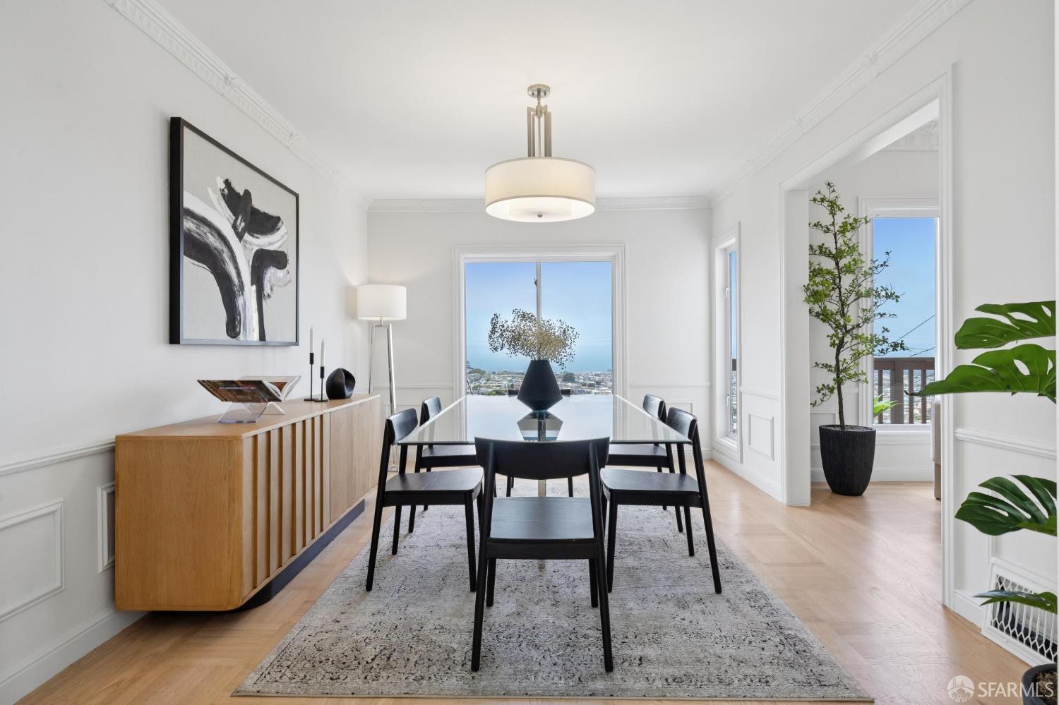 1867 15th Avenue San Francisco, CA 94122 - Photo 12 of 75 a dining room with furniture a rug and a potted plant