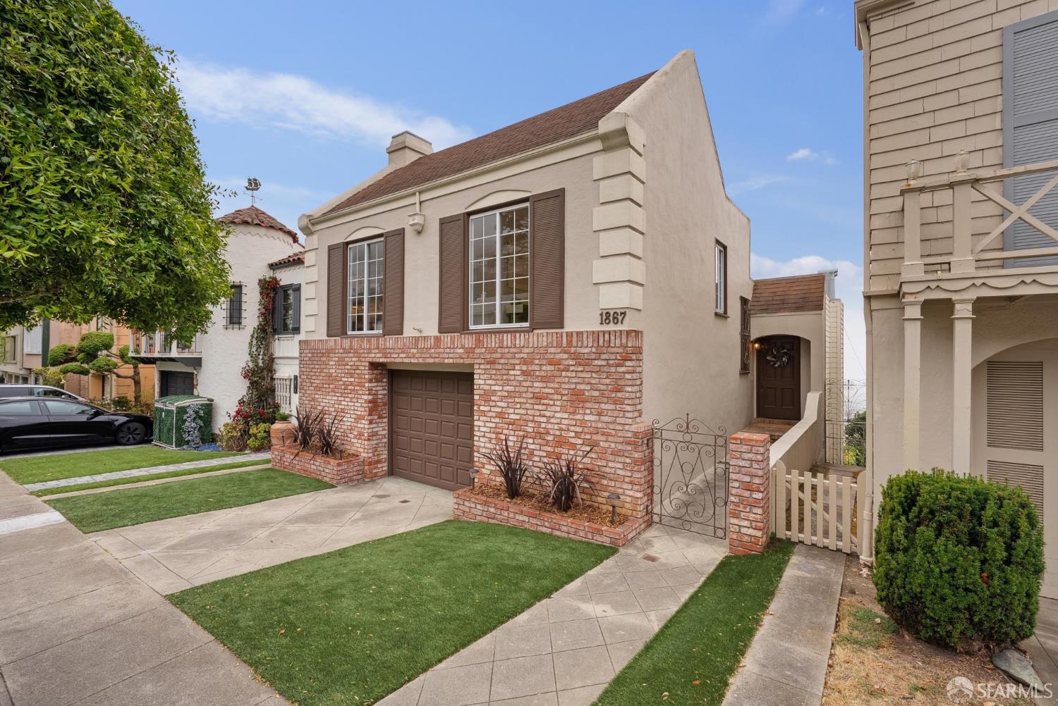 1867 15th Avenue San Francisco, CA 94122 - Photo 2 of 75 a front view of a house with a garden