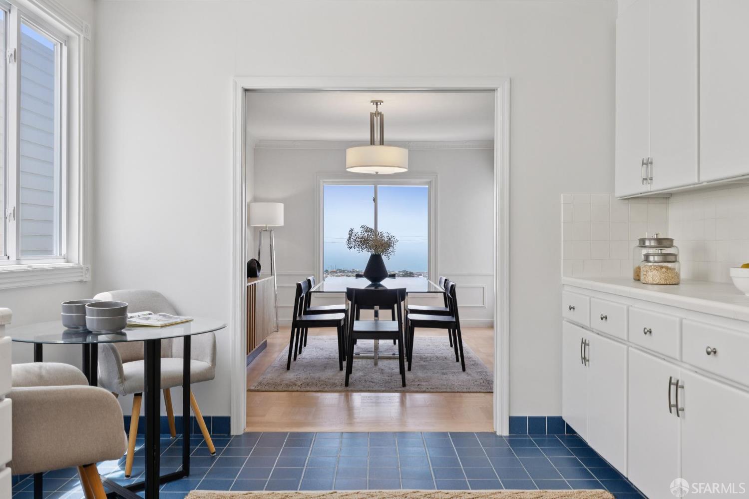 1867 15th Avenue San Francisco, CA 94122 - Photo 21 of 75 a dining room with wooden floor a chandelier a wooden table and chairs
