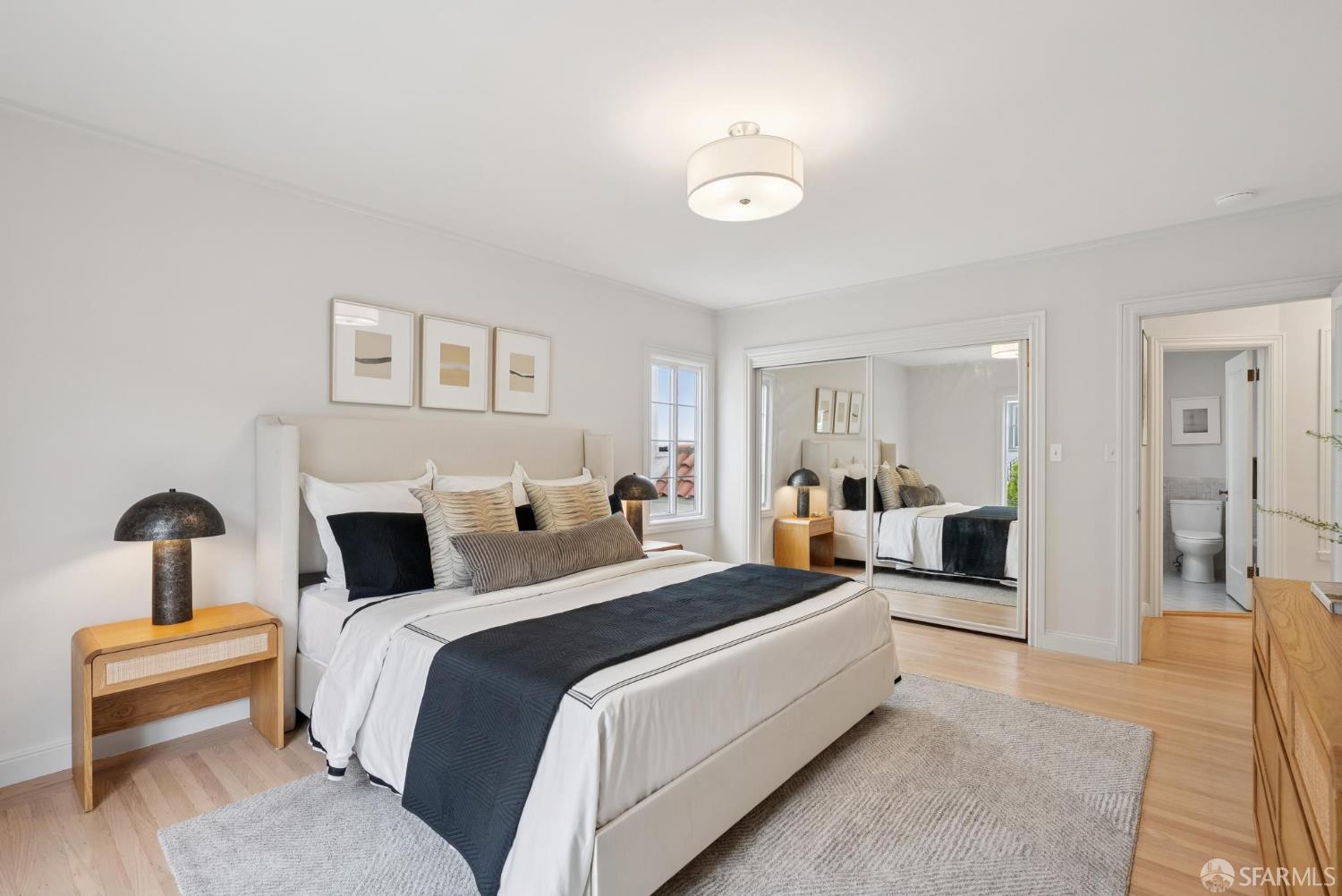 1867 15th Avenue San Francisco, CA 94122 - Photo 26 of 75 a bed room with a bed and a chandelier