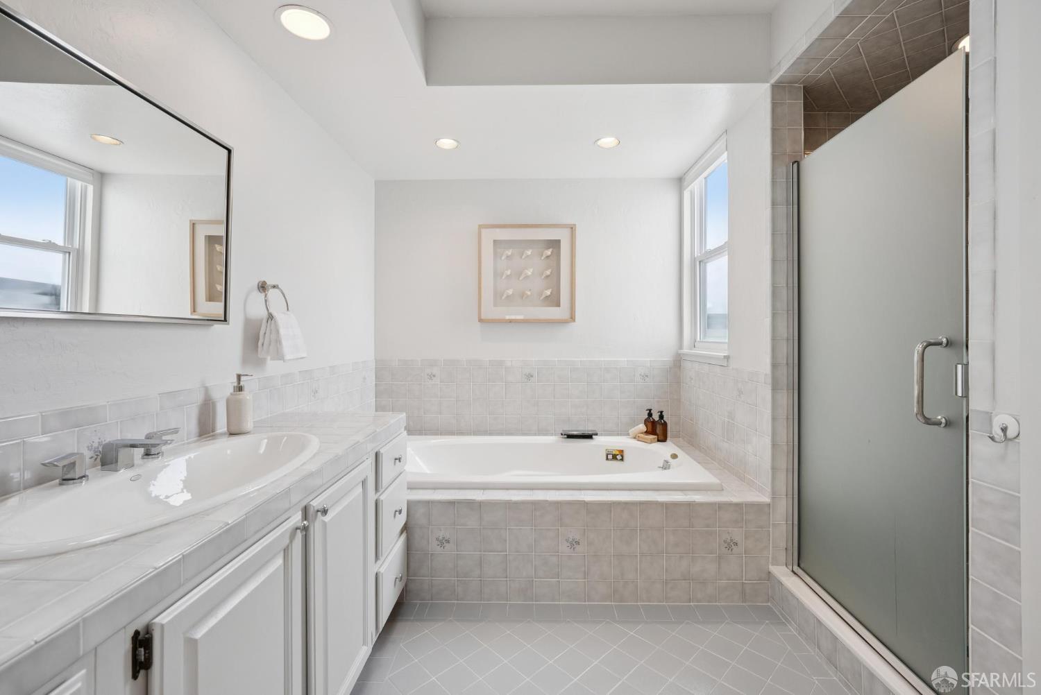 1867 15th Avenue San Francisco, CA 94122 - Photo 29 of 75 a bathroom with a bathtub a sink and a mirror
