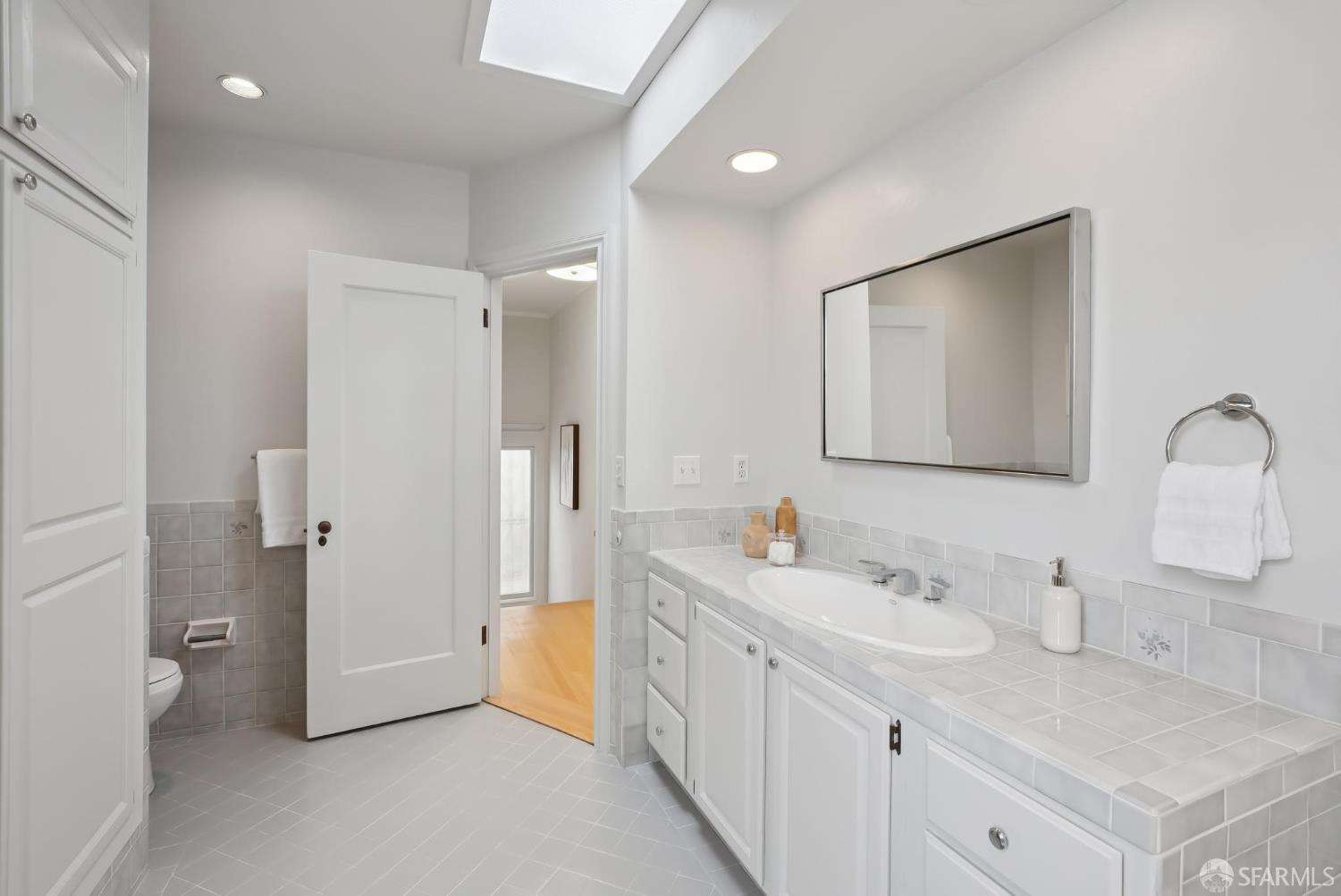 1867 15th Avenue San Francisco, CA 94122 - Photo 31 of 75 a bathroom with a double vanity sink mirror and toilet